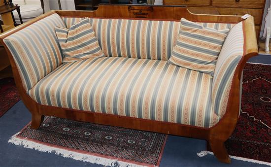 A 19th century Biedermeier satin birch settee, with striped upholstery L.180cm